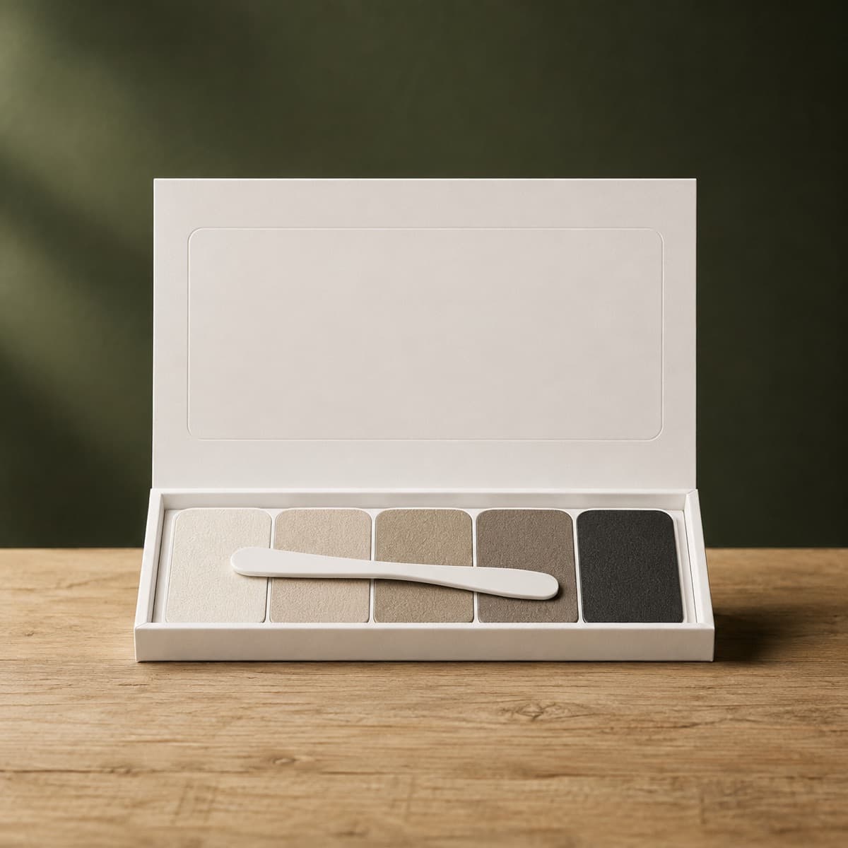 Leather Repair Patch Kit (Self-Adhesive) — wax-white packaging on an oak surface against a moss-green background